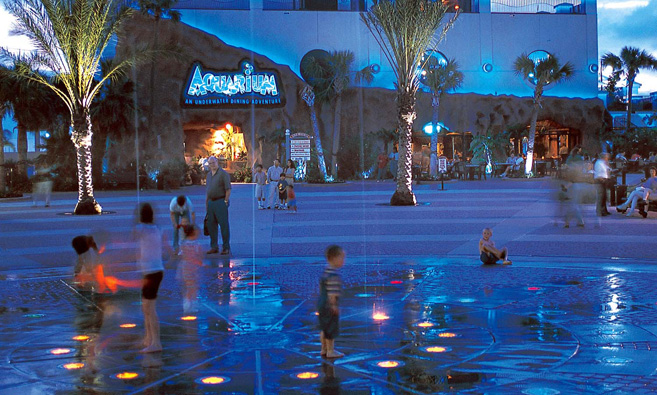 Playing in the fountains outside the aquarium