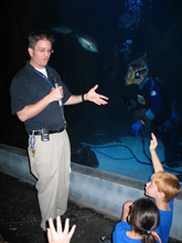 Aquarium worker explaining the exhibits